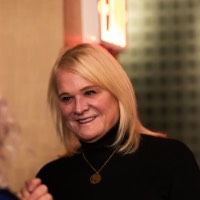 Woman smiling at Susan Proctor